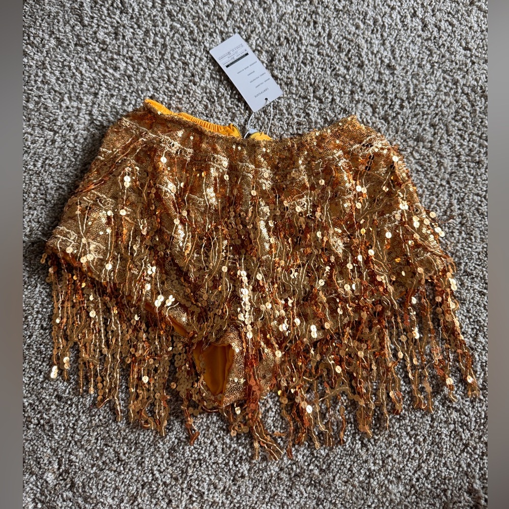 Gold sparkly booty shorts, size small.